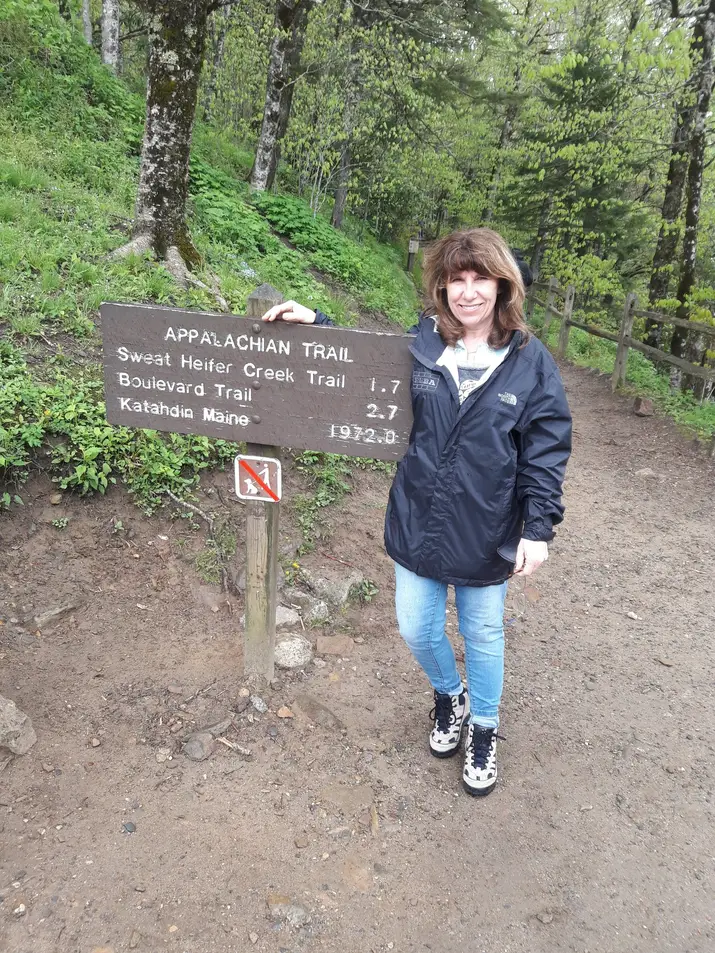 Woman standing at the Appalachian trail sign in NC